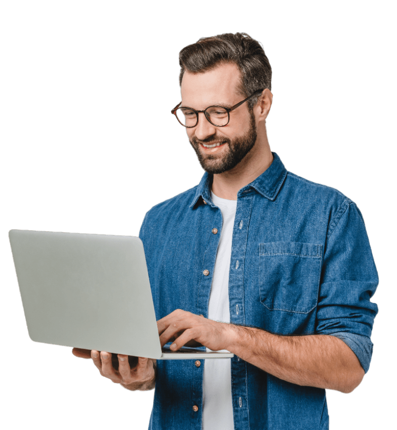 Man holding a laptop, looking at the screen and appearing focused or ready to work